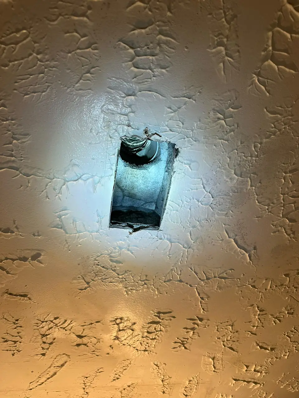 Flashlight inspection inside a ceiling air vent